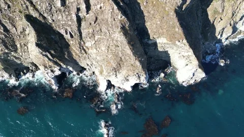 Aerial View of Steep Rocky Cliffs and Ocean Waves in Big Sur California Video stock 318624873