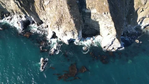 Aerial View of Steep Rocky Cliffs and Ocean Waves in Big Sur California Video stock 318624880