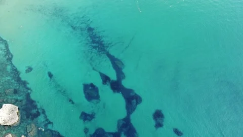 Aerial view of steep white limestone cliffs and blue Mediterranean sea on t.. Stock Footage 325801750