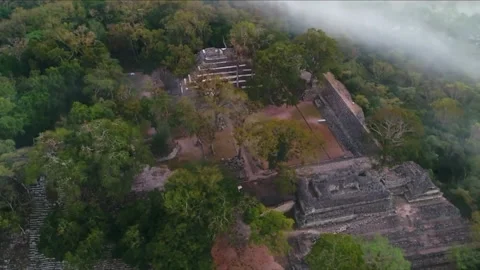 Aerial view of a stepped pyramid in the forest Video stock 146647969