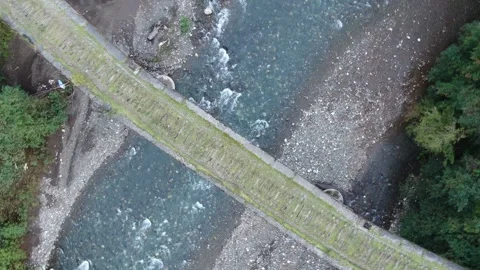 Aerial view stone Bridge over the mountain river, Abkhazia. Stock Footage 315208676