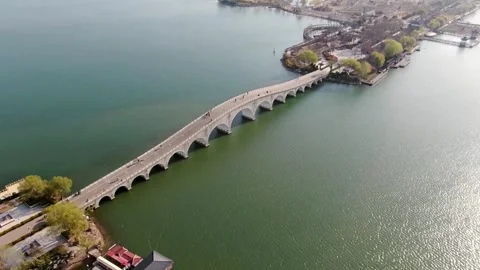 Aerial view of stone bridge over lake. Video stock 336339717