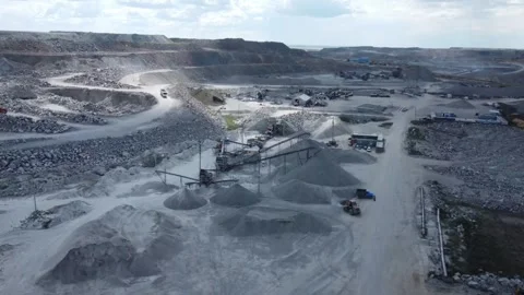 Aerial View of Stone Crusher with Multiple Conveyors and Loader at Worksite Stock Footage 314053895