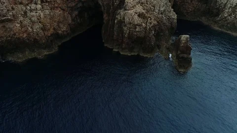Aerial view of stone lighthouse on the edge of a cliff Stock Footage 120641908