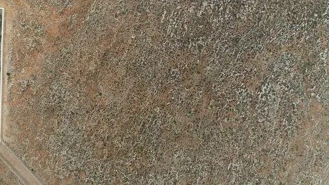 Aerial view of stone lighthouse on the edge of a cliff Stock Footage 120641945