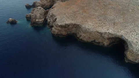 Aerial view of stone lighthouse on the edge of a cliff Stock Footage 120642032