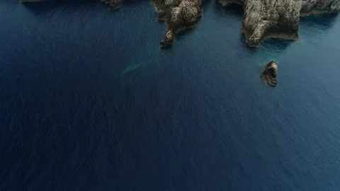 Aerial view of stone lighthouse on the edge of a cliff Stock Footage 120945305
