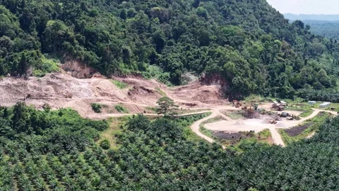 Aerial view of a stone mining site from a rocky mountain surrounded by oil .. Video stock 337015500