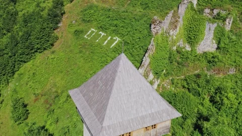 Aerial view of stone observation tower in forested landscape, Bosnia Stock Footage 324711630