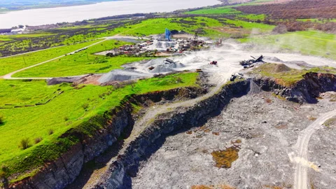 Aerial view of stone quarry processing plant beside lake, Bulgaria Stockbeeldmateriaal 345151279