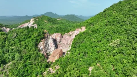 Aerial view of a stone quarry surrounded by forest. Vídeo Stock 340564460