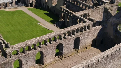 Aerial view of the stone ruins of an ancient abbey Stock Footage 336809972