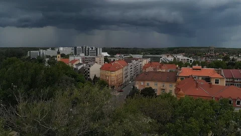 Aerial view of storm clouds with pouring rain over the city Dlog Stock Footage 127037039