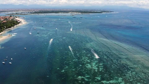 Aerial view of the strait with a small boats in Nusa Dua, Bali. Stock Footage 103515433