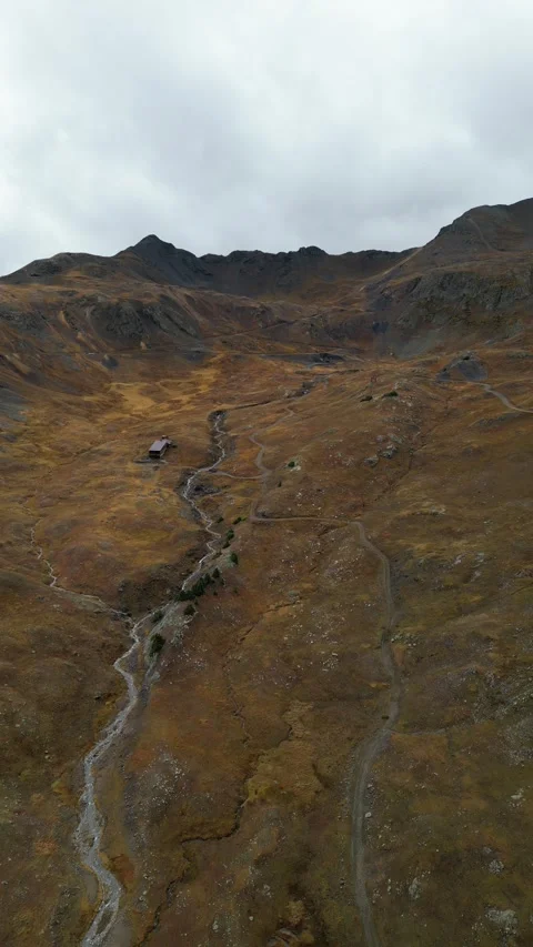 Aerial View of Stream Flowing Through Valley Stock Footage 274510060
