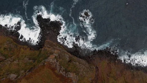 Aerial view of a stream of water falling down from a cliff top in North Iceland Video stock 119208496