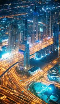 Aerial View Of Street Night Traffic Of Illuminated Cityscape With Skyscraper In Stock Photos
