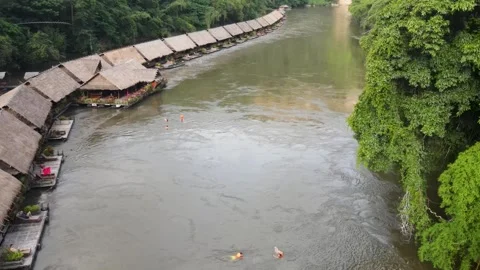 Aerial view of string of floating hotels along the River Kwai. Tourists Stock Footage 252571778