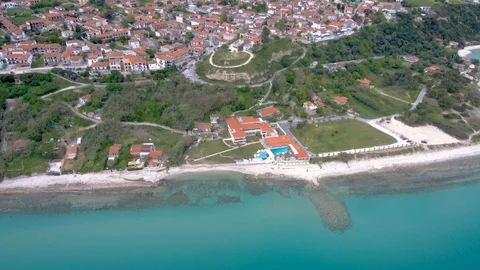 Aerial view of  stunning beach under a tourist village, Athitos Halkidiki Greece Stock-Footage 112724184