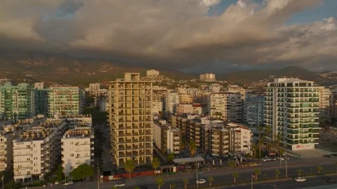 Aerial View: A stunning development rises on the coastline as the framework of a Stock Footage 296078767
