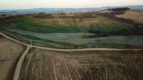 Aerial view, stunning flight over the green Tuscany Hills at sunset Stock Footage 103278995