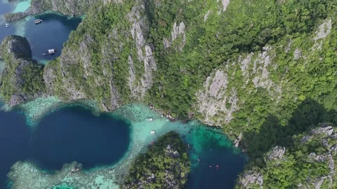 Aerial View of Stunning Limestone Cliffs and Lagoons in a Tropical Paradise Stock Footage 295791662