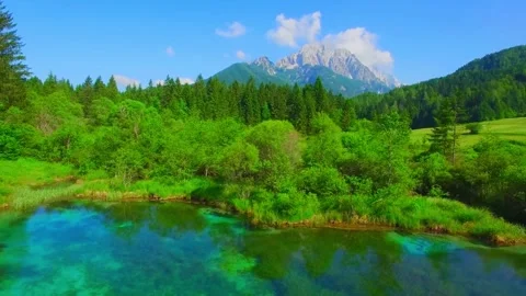 "Aerial View: Stunning Reflection of Ponce Mountains in Zelenci Springs Amid Gol Stock Footage 288007985
