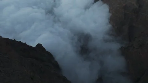 Aerial view of the stunning sea of clouds inside the Caldera de Taburiente, La Stock Footage 317529233