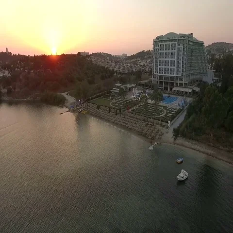 Aerial view of the stunning sunset over the Aegean Sea, the resort town Vídeos de archivo 69700571