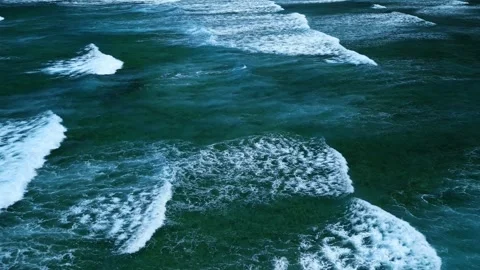 Aerial view of stunning texture and power of dark ocean waves with white foam Stock Footage 274372086