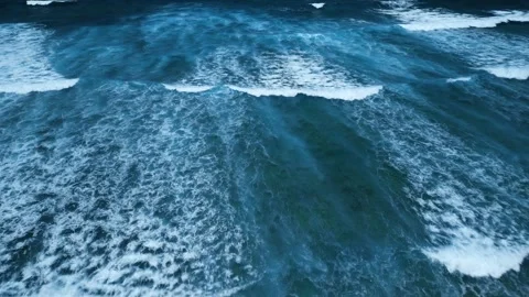 Aerial view of stunning texture and power of dark ocean waves with white foam Stock Footage 274372099