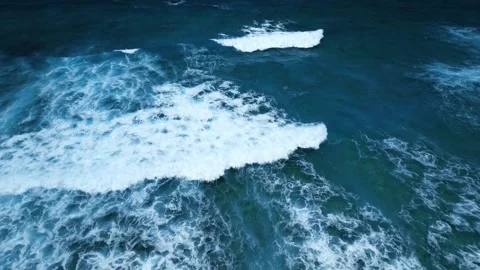 Aerial view of stunning texture and power of dark ocean waves with white foam Stock Footage 274372111