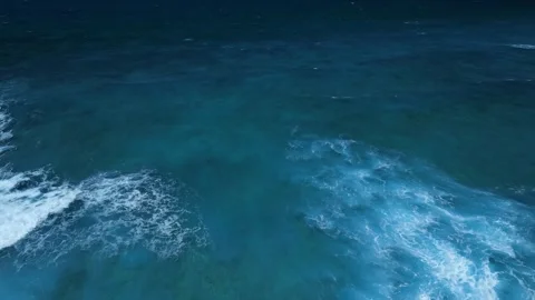 Aerial view of stunning texture and power of dark ocean waves with white foam Video stock 274372205