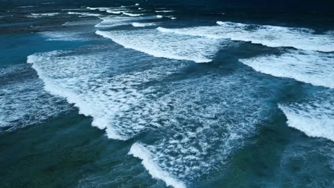 Aerial view of stunning texture and power of dark ocean waves with white foam Stock Footage 274372485
