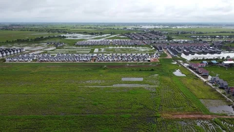 Aerial view of subsidized housing built on agricultural land in Banjarmasin Stock Footage 329401589