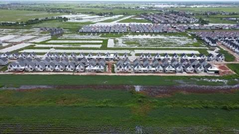 Aerial view of subsidized housing built on agricultural land in Banjarmasin Stock Footage 330729677
