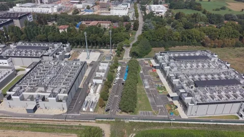 Aerial view of a substantial industrial data center DATA4 facility, with Stock Footage 346013625