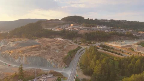 Aerial view of a suburban development with homes on a hillside Stock Footage 285467700