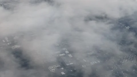 Aerial view of suburban landscape with clouds clearing Stock Footage 338419105
