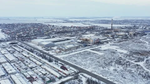 Aerial view of the suburbs in the evening at sunset on a winter day Stock Footage 236200407