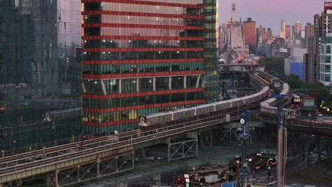 Aerial view of the subway passing through Queens at sunrise Video stock 254115605