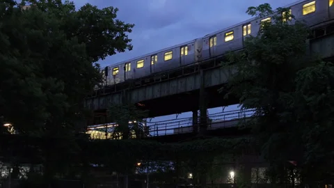 Aerial view of the subway passing through Brooklyn on a summer morning Stock Footage 287485343