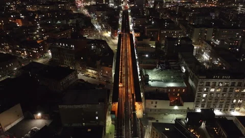 Aerial view of the subway passing through Brooklyn Stock Footage 300599360
