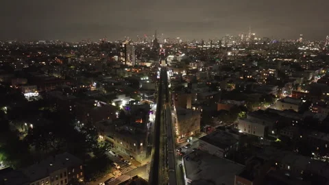 Aerial view of a subway train at night in Brooklyn Stock Footage 287848637