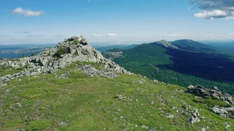 Aerial view of Suka mountain range in Ural, drone flies near stones and boulders Stock Footage 138002553