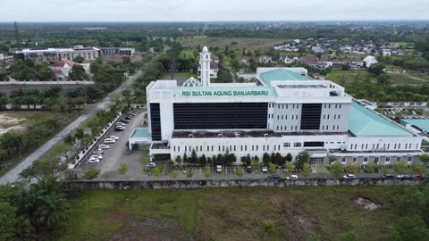 Aerial view of the Sultan Agung Islamic Hospital building in Banjarmasin Stock Footage 328971691