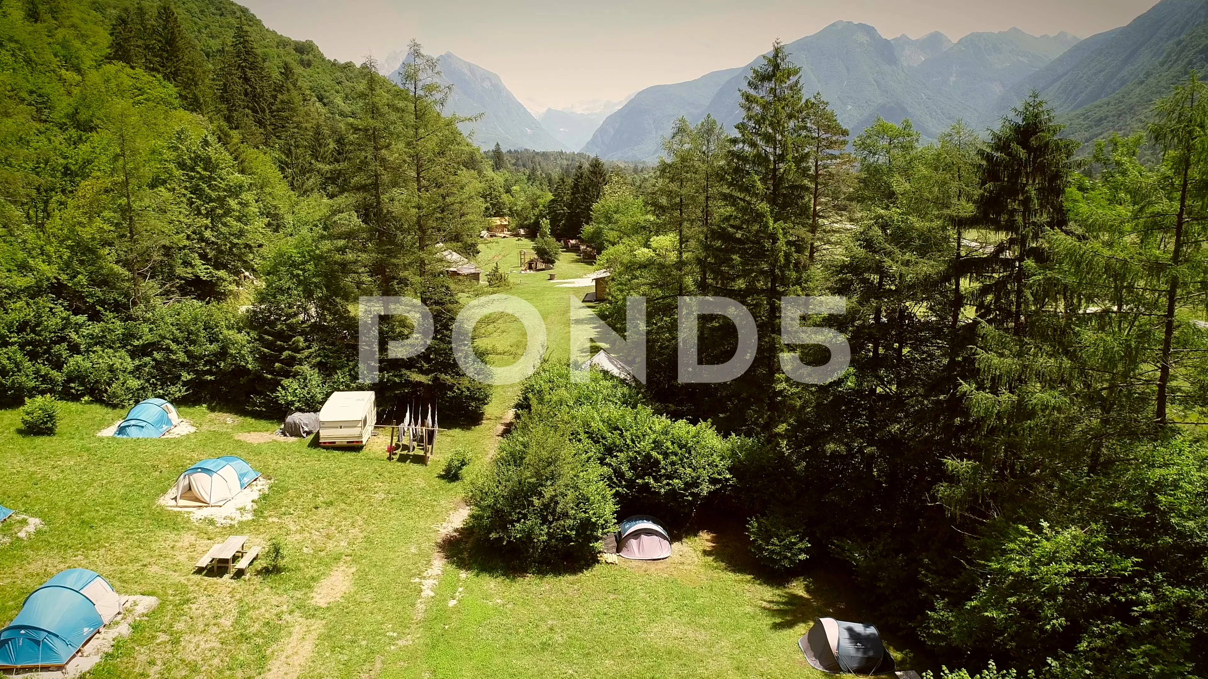 Aerial View Of A Summer Camp With Cabins And Recreational Area In
