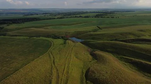 Aerial view of summer fields being, farmland and country landscape Stock Photos