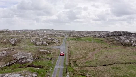 Aerial view summer road: red car travel view,drive. Gorgeous irish fields,nature Stock Footage 201466720