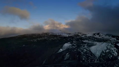 Aerial view of the summit of Volcano pico Viejo, covered with snow and clouds. Video stock 146868613